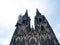 Cologne Cathedral with scaffold against cloudy sky