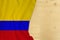 Colombia country colored silk national flag, empty wooden mocap for text, concept of tourism, travel, emigration, global business