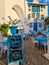 Colombia, Doradal, outdoor tables and chairs in the Santorini district