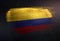 Colombia Flag Made of Metallic Brush Paint on Grunge Dark Wall