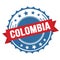 COLOMBIA text on red blue ribbon stamp