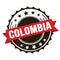 COLOMBIA text on red brown ribbon stamp