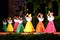 Colombian beauties dancing at night outdoor festival stage