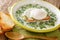 Colombian Breakfast Milk Soup Changua closeup in the plate. horizontal