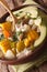 Colombian cuisine: ajiaco soup close up in a bowl. vertical