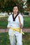 Colombian, Latin American woman practicing taekwondo with nunchakus left side defense