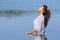 Colombian woman stands in water of lake