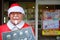 Colonel Harland Sanders Figure in Santa Claus costume standing in front of Kentucky Fried Chicken restaurant in Otaru.