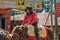 Colonia Independencia, Paraguay - May 14, 2018: A beautiful woman proudly rides her horse during the annual Paraguayan Independenc