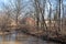 Colonial American log cabin in the woods by a river