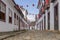 A colonial architecture street adorned with flags for the Divine Holy Spirit Festivity in Paraty, Brazil.