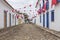 A colonial architecture street in Paraty, adorned with flags for the traditional Divine Holy Spirit Festivity. Brazil.
