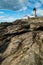 Colonial Beavertail Lighthouse on Rocky Coastline