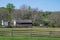 Colonial idyllic rural village scene with barn store house outbuilding