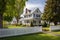 colonial revival house with a white picket fence