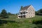 Colonial stone three story farm house