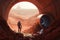 colonist, digging new tunnel in red soil of mars, with view of distant valley
