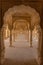 Colonnade Passageway with arched pillars at Hall of Mirrors Sheesh Mahal at Amer Palace, Amber Fort, Jaipur