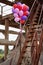 Color balloons on rusty staircase