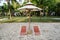 Color beach chairs and white umbrella