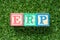 Color block in word ERP abbreviation of Enterprise Resource Planning on artificial green grass background