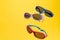 Color Children sunglasses isolated on yellow background. Concept of sun protection summer and vacation. copy space.