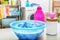 Color clothes with foam in basin and detergent