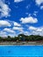 Color combination of sky, trees and pool water