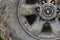 Color detail shot of an off-road car`s wheel, covered in mud