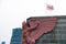 Color Garuda statue on the top of the building and Thai national flag.