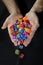 Color glass dices in man`s hands