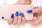 color gloss manicure hand has different blotches in a light background