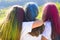 Color hair. Tree best girfriends with colorful hair enjoing in the moment. Colorful holi on painted hair. Happy life in