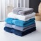 Color harmony Blue, white, and gray towels stacked, creating a stylish ensemble