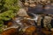 Color Jizerka river near confluence with Jizera creek in spring winter sunny day