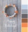 Color matching palette from picture of wattle wreath with dry orange and yellow Autumn leaves on grey aged wooden door