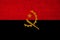 Color national flag of modern Angola state on beautiful canvas fabric, concept of tourism, economy, politics, emigration, closeup