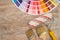 Color palette guide and paint brush roller  on wood board