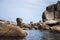 Color photo of sea stones of strange abstract dog shape