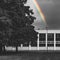 Color selective rainbow behind a socialist abandoned house