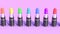 Color set lipstick in beautiful style on pink background Cosmetic products able to loop seamless