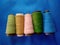 Color Sewing Threads, Stitching Threads on Non Woven Fabric Background