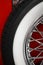 Color shot of a vintage car spoke wheel