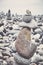 Color toned picture of a volcanic stones stack on a beach