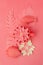 Color of year 2019 Living Coral concept. Fish toys set and origami papercraft flowers, branches on living coral background,