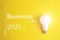 Color of the Year 2021. Glowing bulb on yellow background. Color trend. Illuminating. Idea, innovation, creativity concept