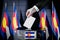 Colorado flags, hand dropping ballot card into a box - voting, election concept - 3D illustration