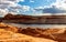 Colorado river and its banks shining under the evening sun, The Chains, Page, Arizona, USA