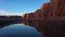 Colorado River and Red Sandstone Cliffs on Sunny Day. Utah, USA. Aerial View