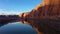 Colorado River and Red Sandstone Cliffs on Sunny Day. Utah, USA. Aerial View